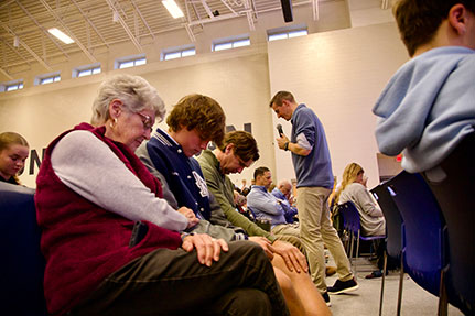 People praying together. Links to Gifts of Cash, Checks, and Credit Cards