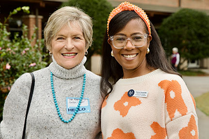 Two women smiling at the camera. Links to Gifts from Retirement Plans